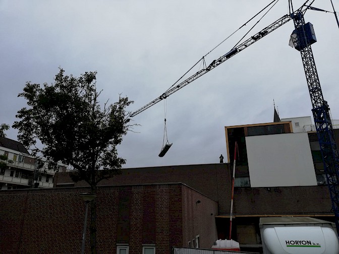 Afhijsen asbesthoudend materiaal